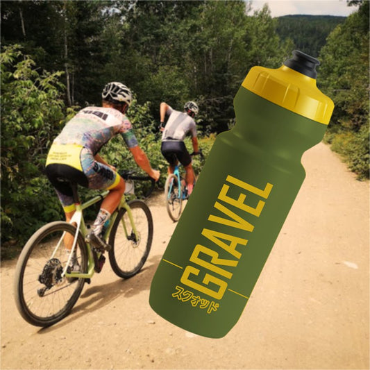 Green GRAVEL MAFIA bidon rendering on a gravel ride photo background