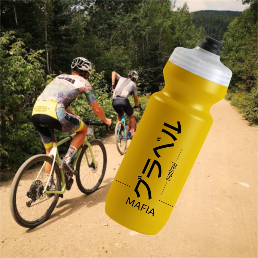 Yellow GRAVEL MAFIA bidon rendering on a gravel ride photo background, back of the bottle