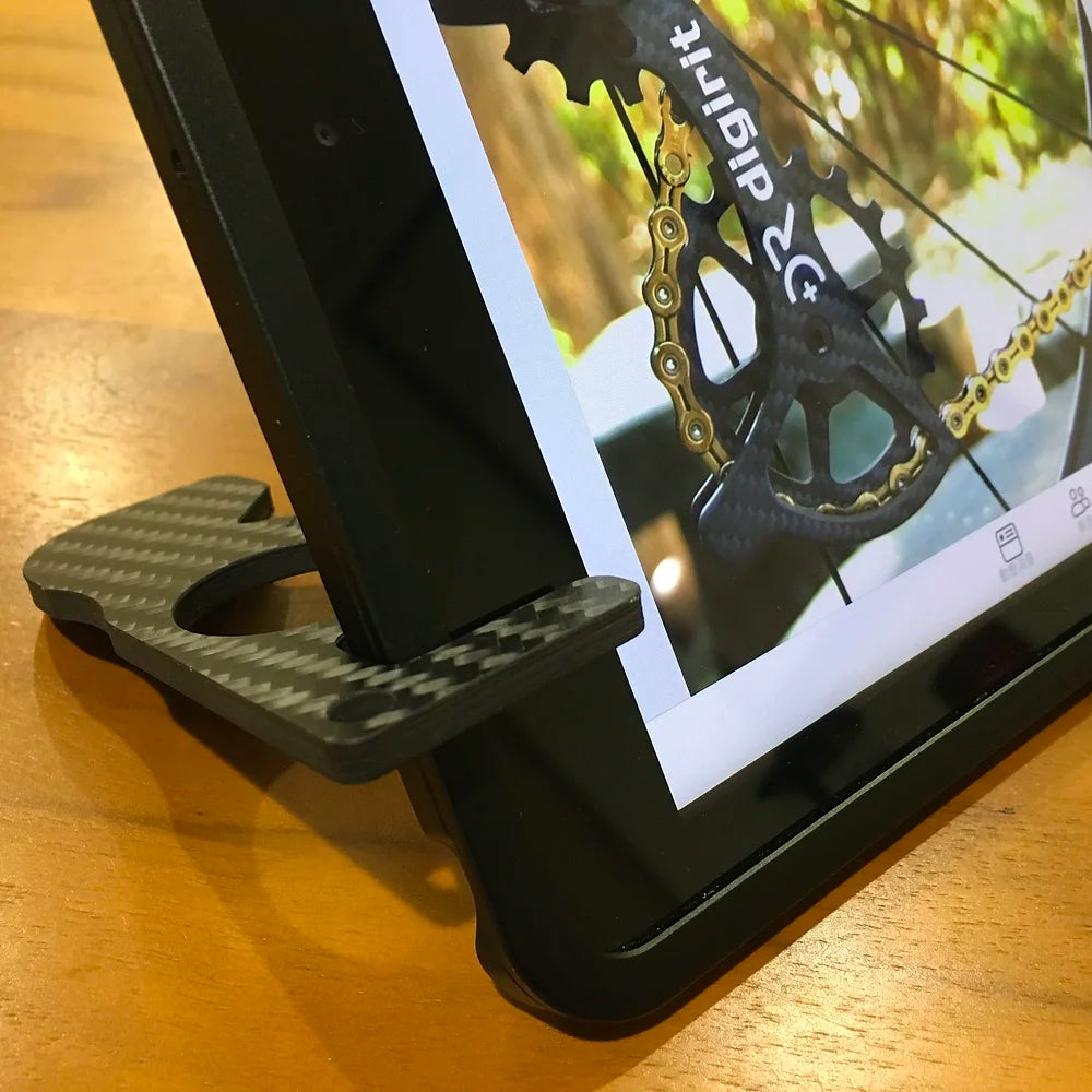 Carbon 3D laser cut bottle opener and cellphone holder by DIGIRIT