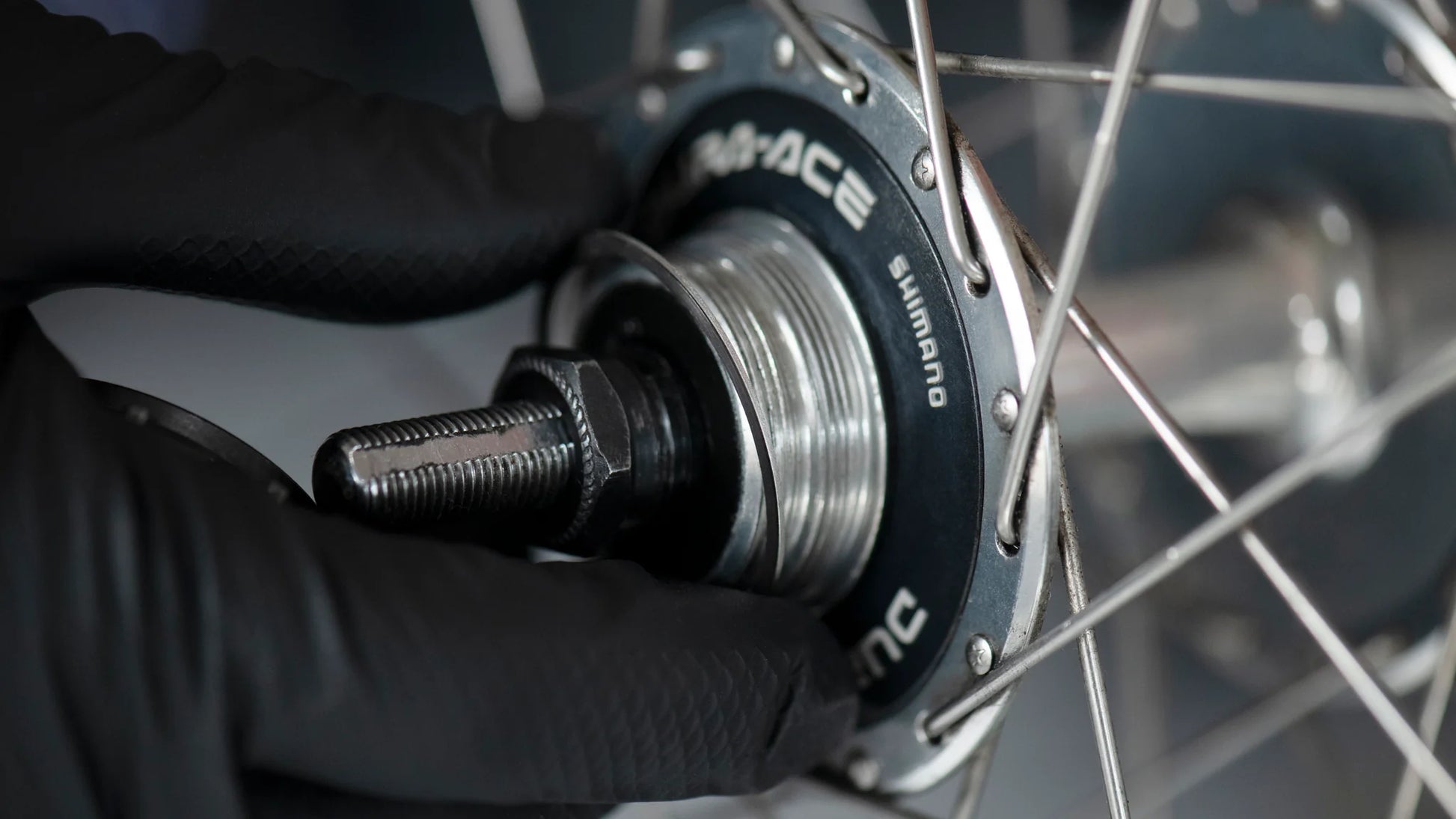 Hakurin stainless spacer being used on a track fixed gear hub rear wheel to adjust chain line