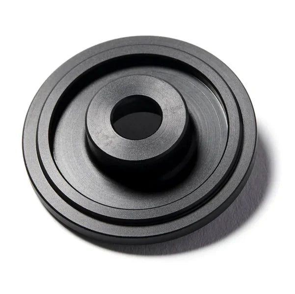 Close-up photo of the Runwell RW TOP CAP made of aluminum anodized black, rear side view
