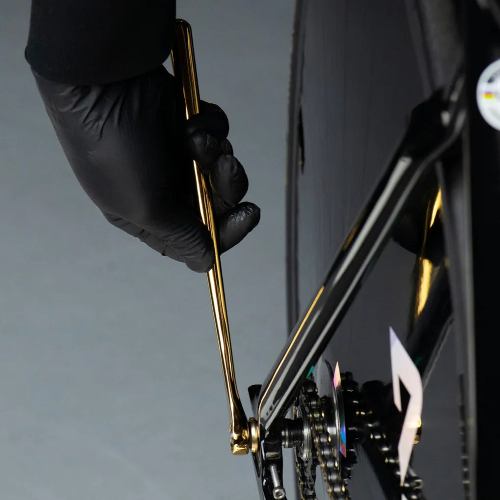 Titanium coated gold wrench Vatto 15mm, used on a track bicycle wheel nut