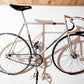 Wall mount for bicycle display, black with fixation hardware, tidy elegant, minimalist, NJS track bike