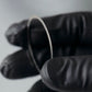 Hakurin stainless spacer scale look in a gloved mechanic hand