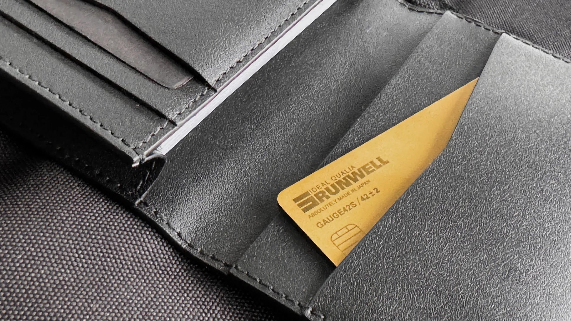 Runwell Gauge 42Si stored in a wallet credit card slot