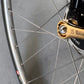 Titanium coated Gold bicycle tool by Runwell Japan, Nezile1510 15mm 10mm action shot on a track bike wheel nut